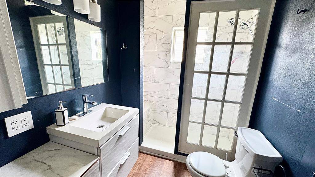 Bathroom with storage and walk in shower