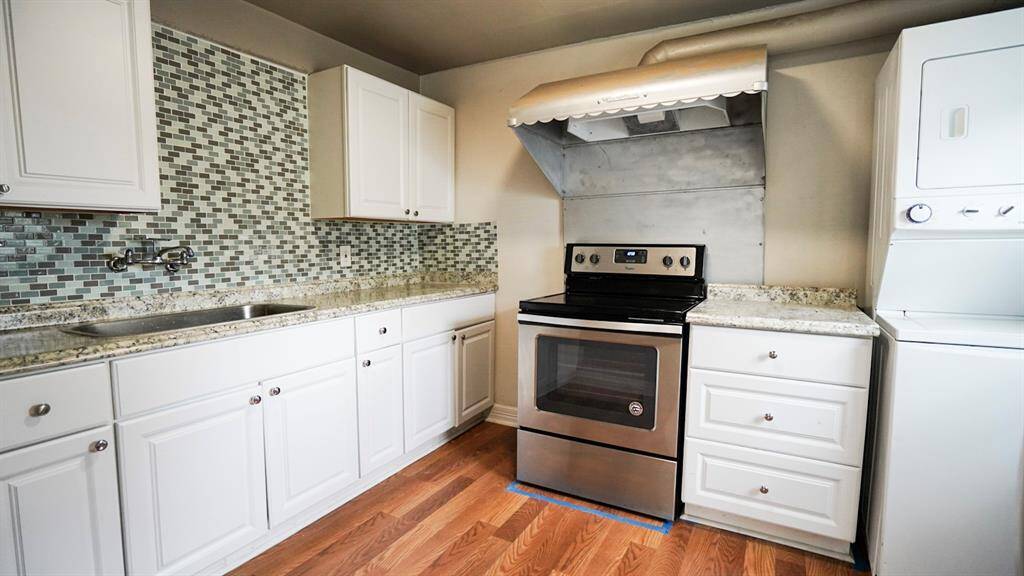 Unit C with stacked washer and dryer