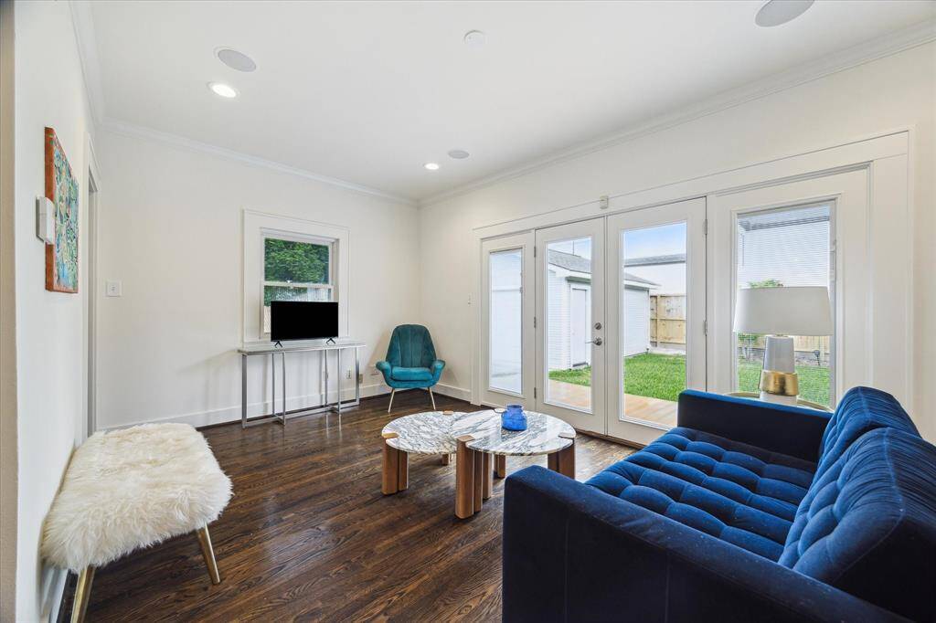 Tucked away at the rear of the home, the family room provides a quiet retreat with views of the backyard through a wall of French doors.