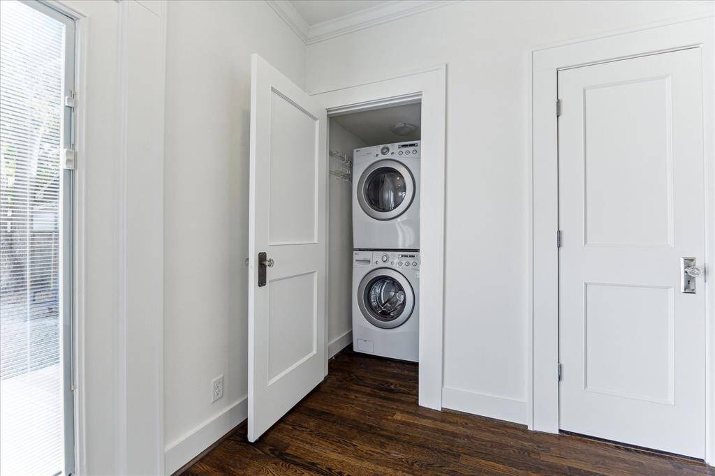 Tucked away near the rear entry, the compact laundry closet features a stacked washer and dryer—making everyday chores convenient and out of sight.