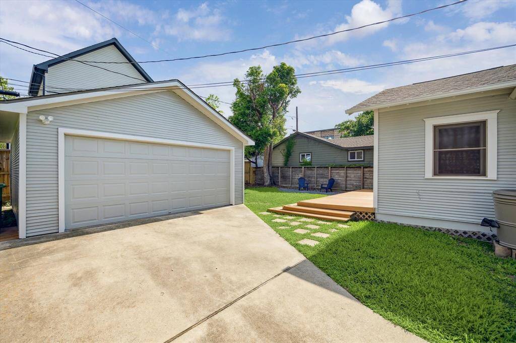 A wide driveway leads to the two-car garage, offering both functionality and convenience.