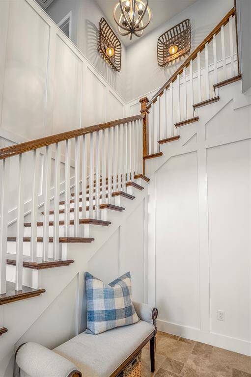 The board and batten and upgraded light fixtures going up the stairs