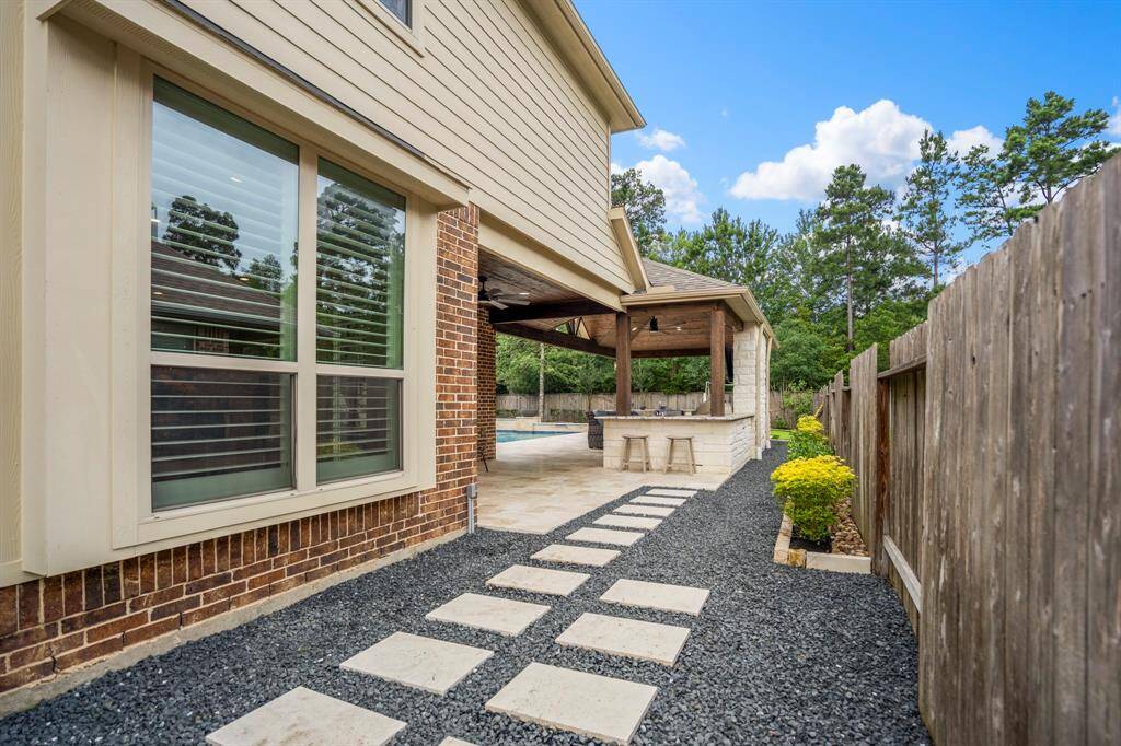 Pathway from the backyard to the side of the home and front gate