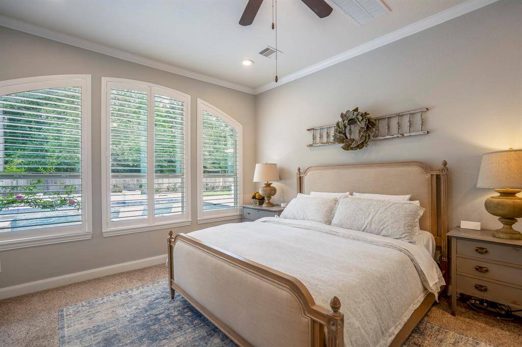 The plantation shutters offer a great view of the pool and backyard
