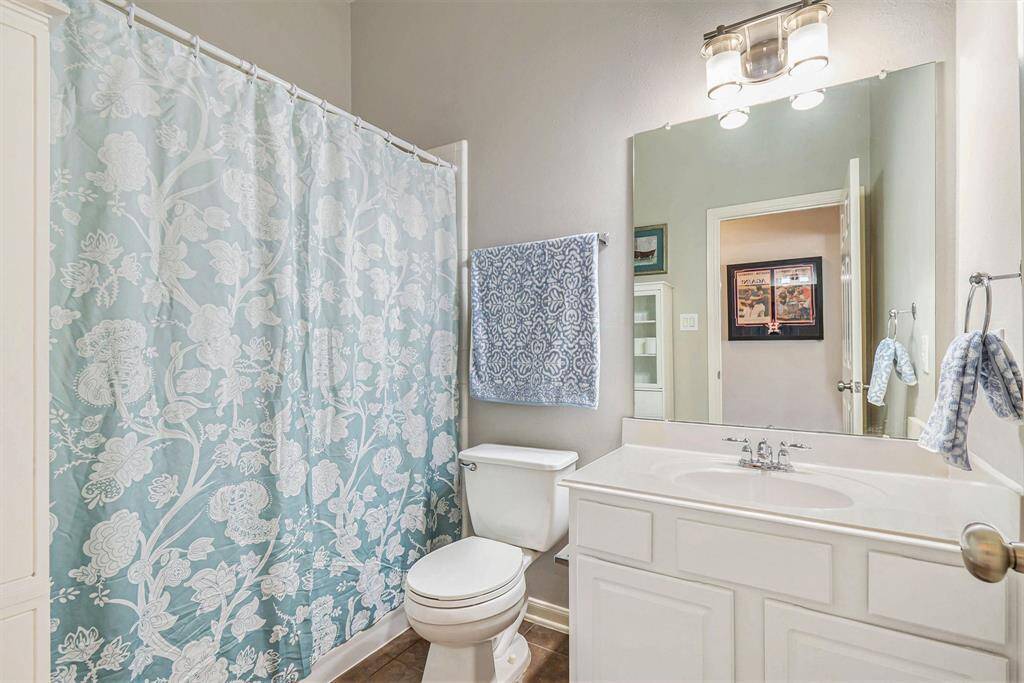 Charming secondary bathroom with a combination tub and shower.