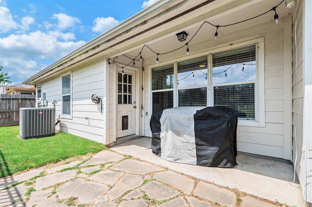 Low maintenance backyard with a big covered patio!