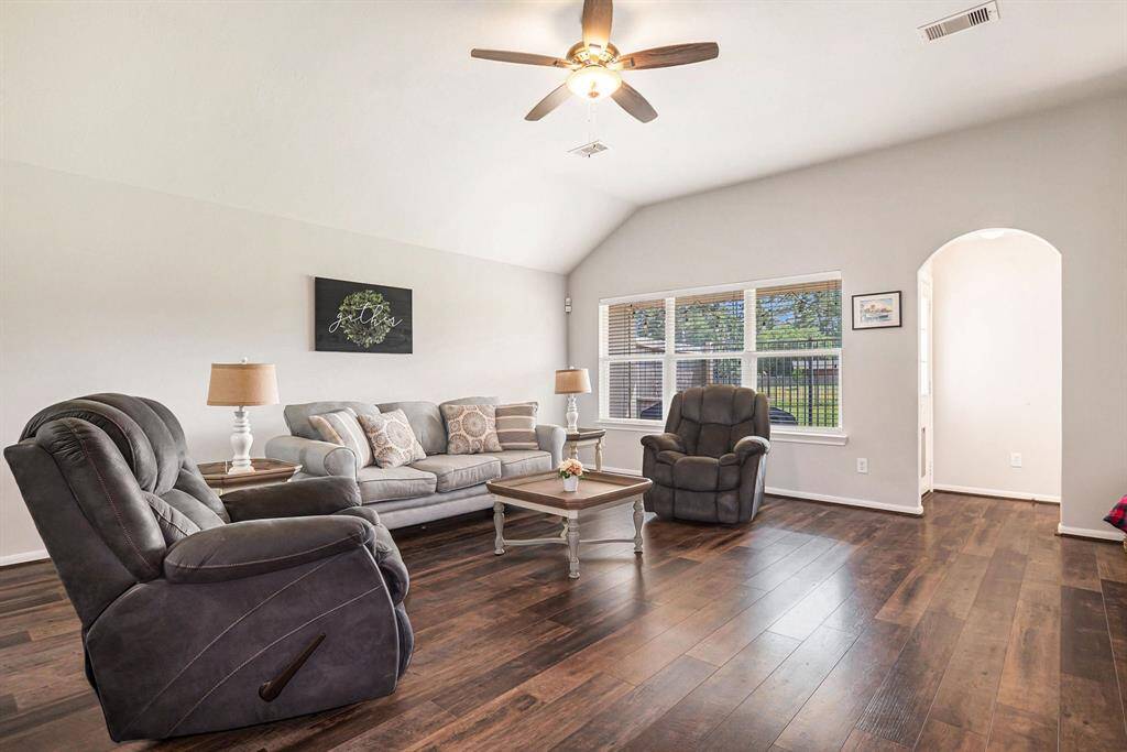 This stunning living room also has great views of the backyard!