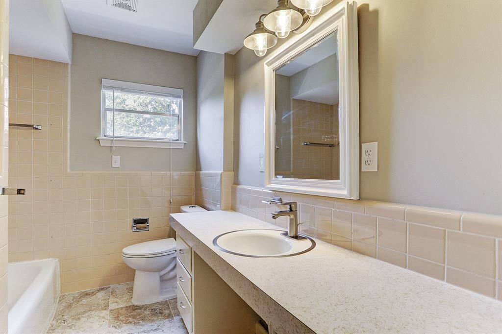 Clean Secondary Bathroom with Tile Tub