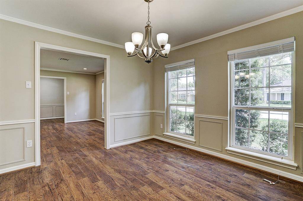 Spacious Formal Dining Area with Custom Chandelier
