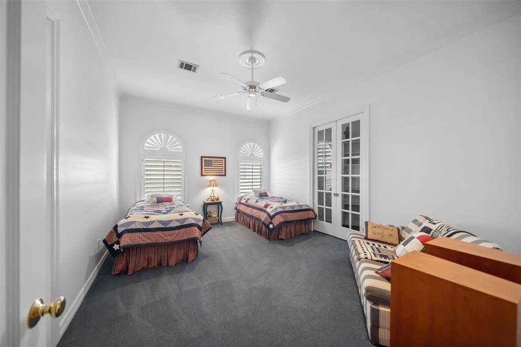 Bedroom Four  Through the pocket French doors is a huge closet with shelves. There is room inside for another twin or junior bed.  With the doors open, the living space expands should you need it to.