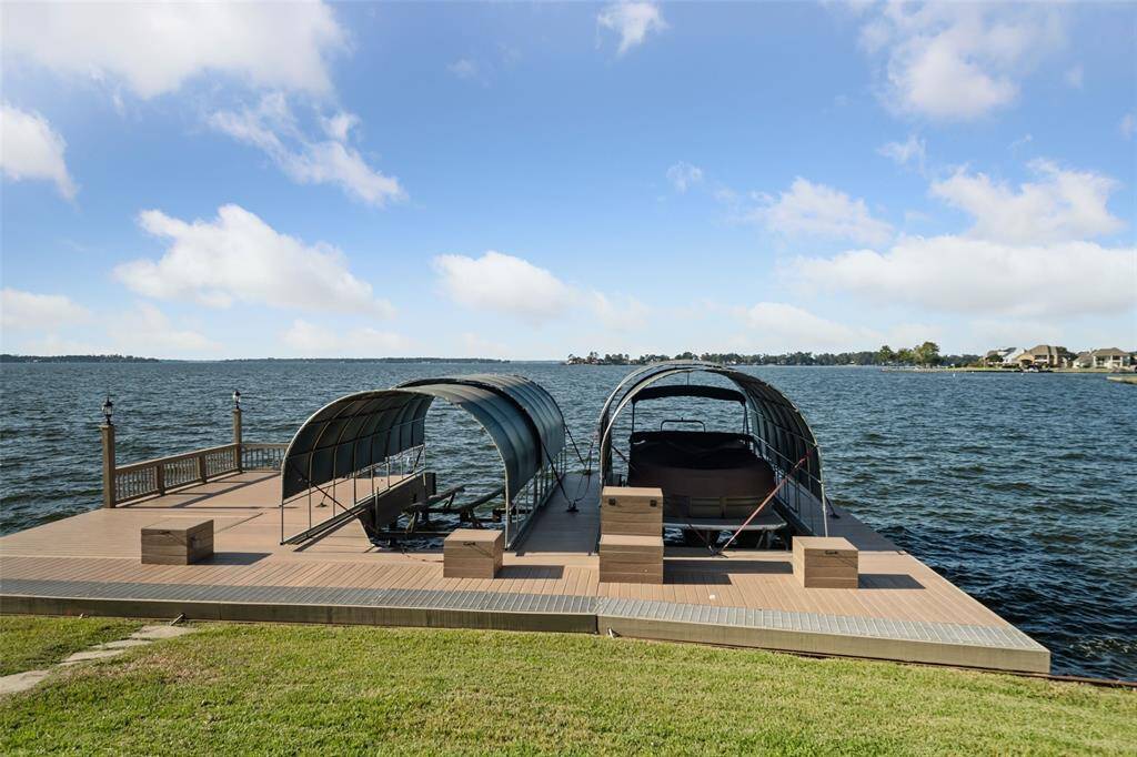 Two covered boat slips with lifts, storage boxes & a fishing dock.  Bring your lawn chair and see what's biting.
