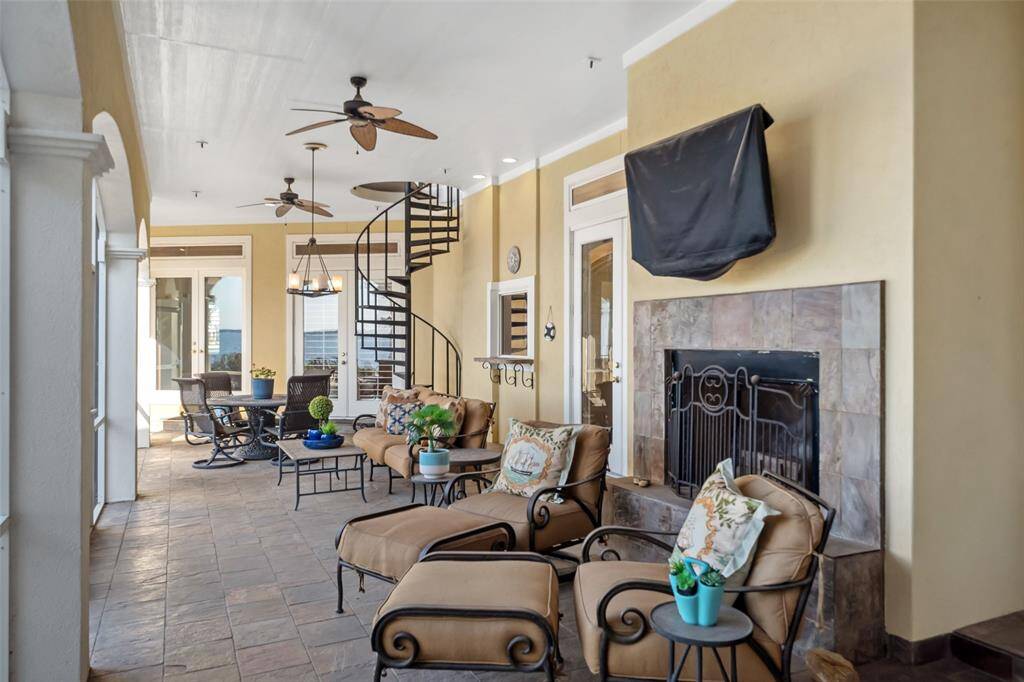 First Floor   Offers fireplace, tv & plenty of space relax.  Also, a bar counter with access to the indoor bar via sliding window.