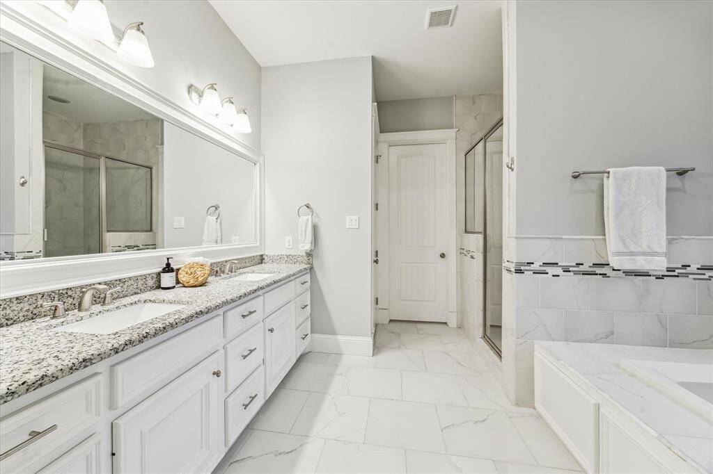 Peaceful primary retreat with spa-like bath and large walk-in closet.