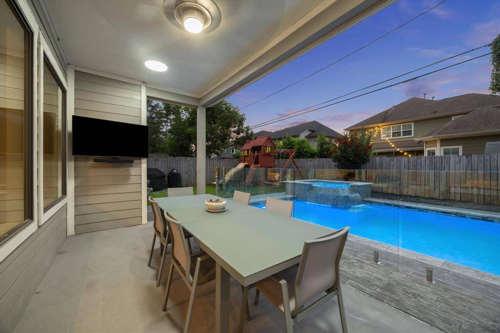 Another view from the covered patio overlooking the pool and play area.