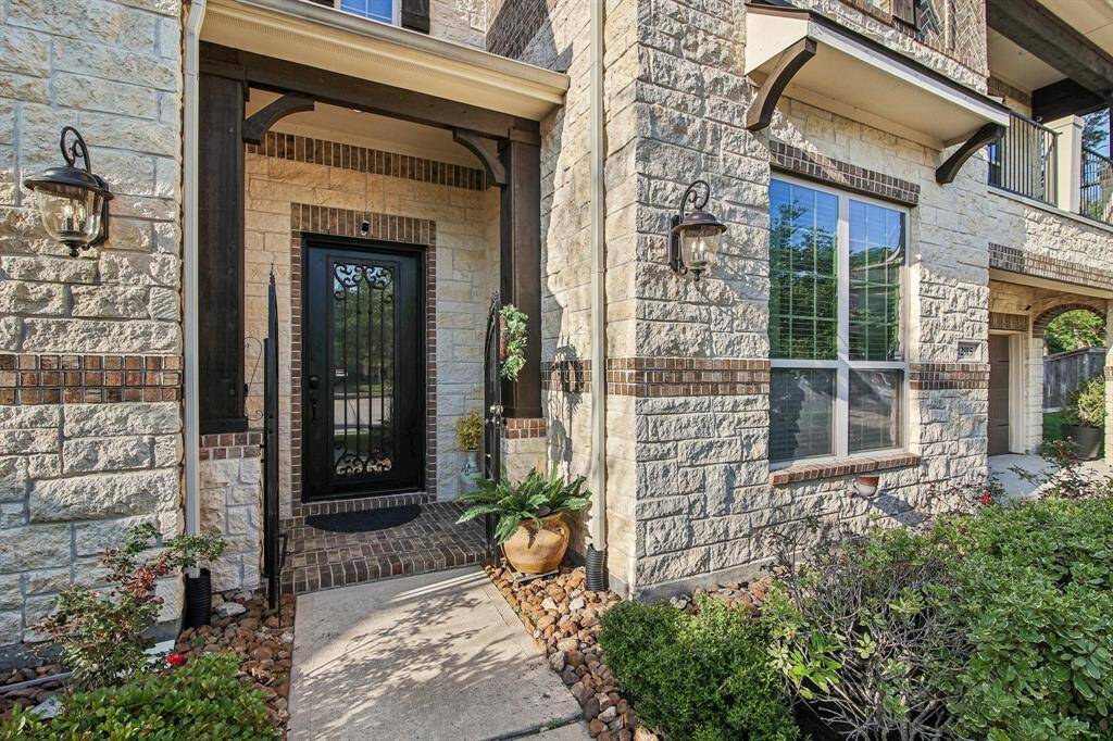 Solid custom door and exterior with Brick and Stone