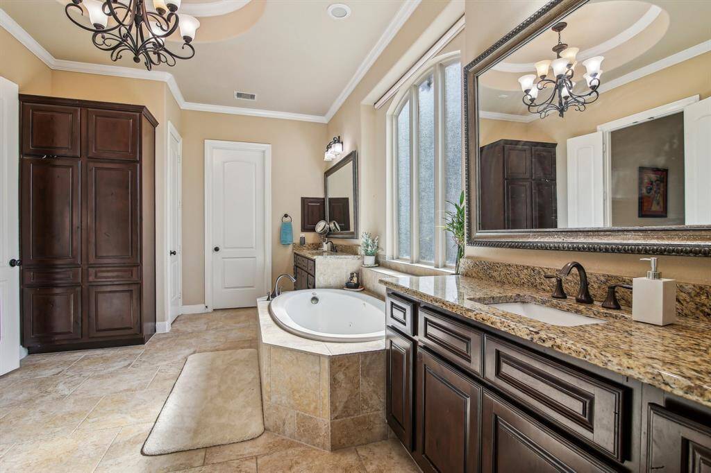 two oversized walk-in closets, providing ample storage and organization space for him and her.