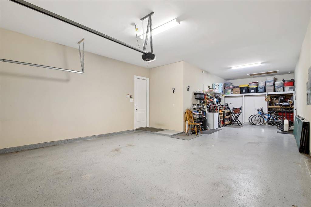 3 car tandem with a door at the back right which is convenient to enter back yard.