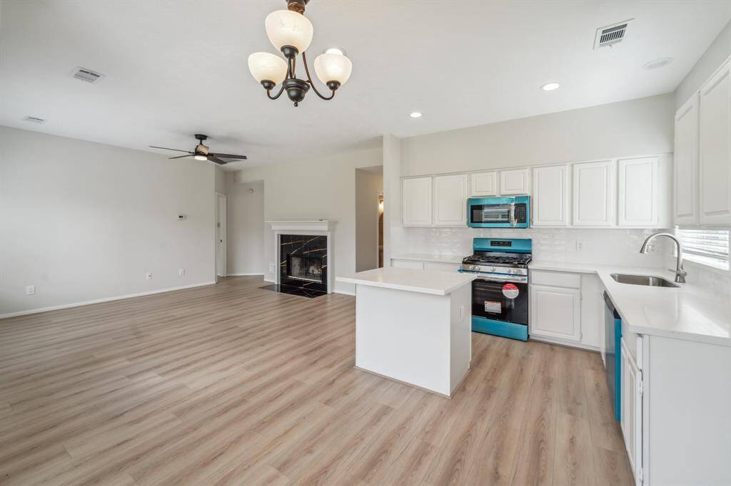 Kitchen boasts new quarts counters, an island