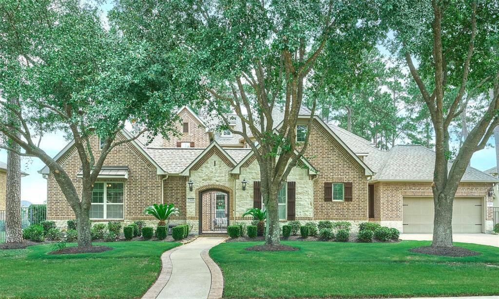 Experience your dream home surrounded by serene greenery, featuring stunning brickwork and an inviting pathway.