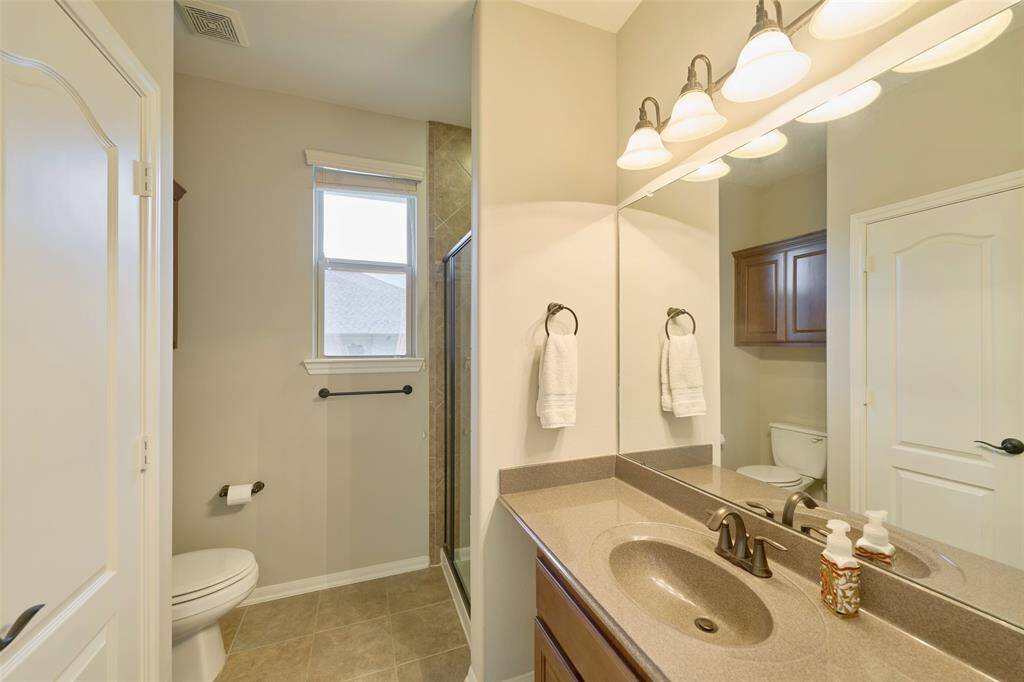 Full bath conveniently located next to office space.