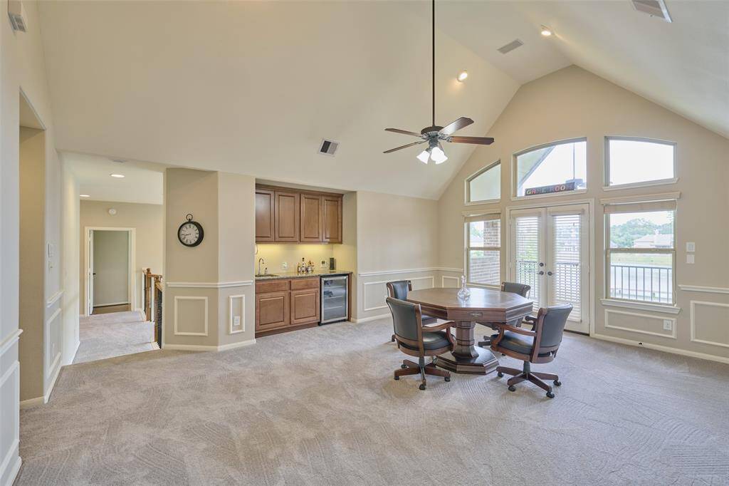 Inviting game room with a wet bar and beverage fridge—ideal for entertaining guests.