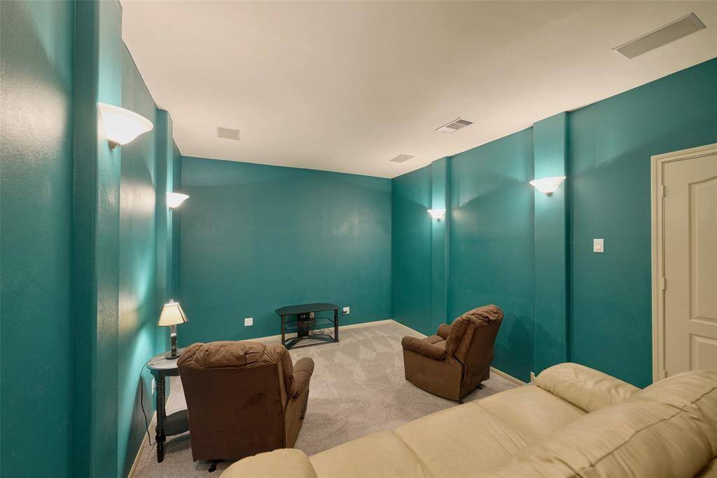 Upstairs media room ideal for entertainment and relaxation.