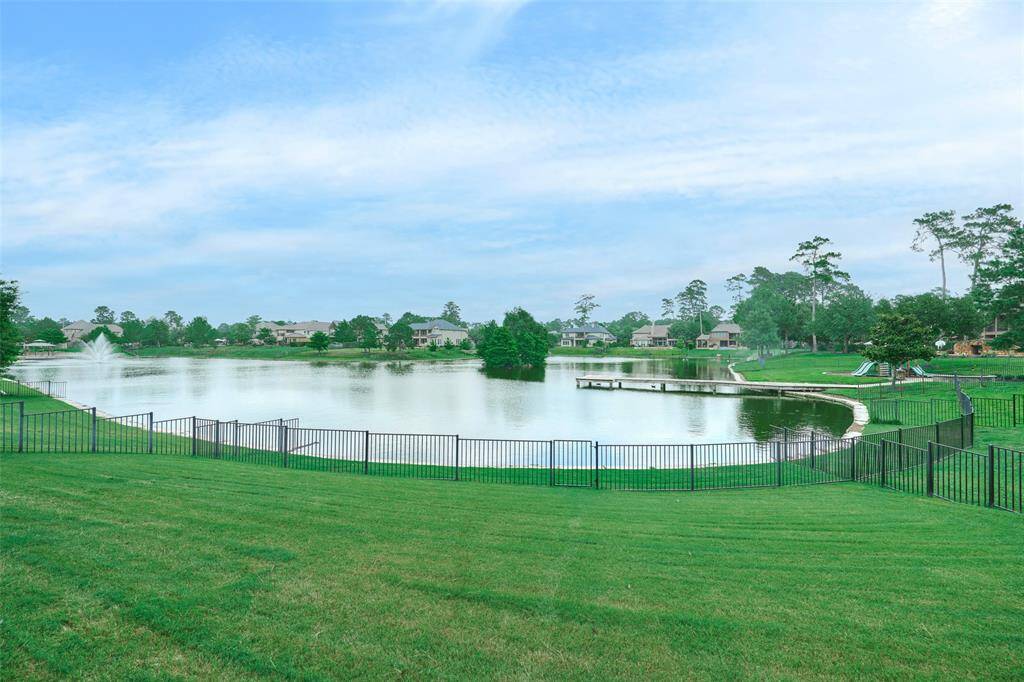 Enjoy tranquil lake views from your back porch, ideal for relaxation and nature appreciation.