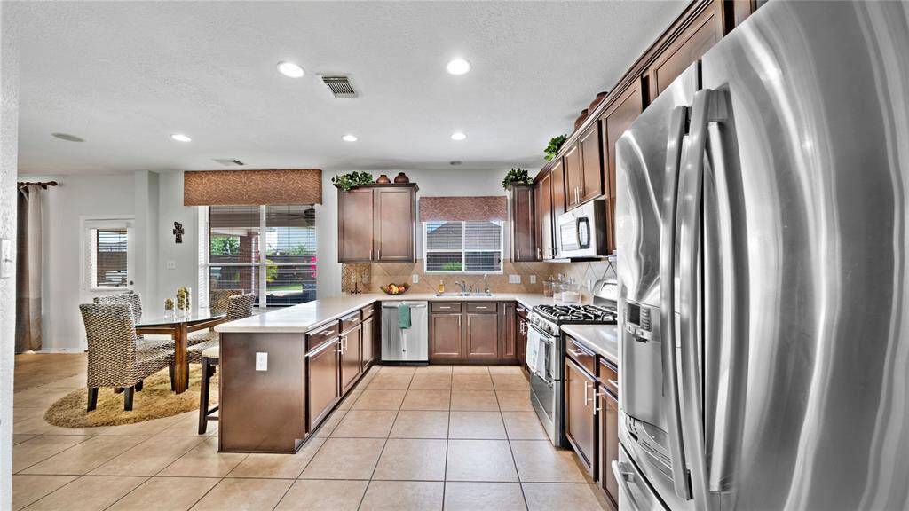 Roomy kitchen with lots of counter and cabinet space.