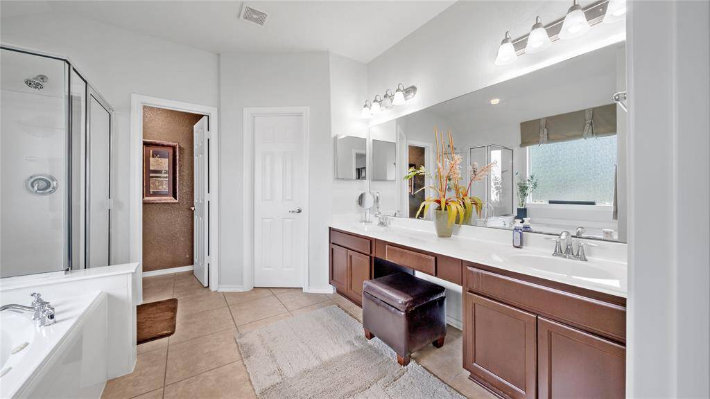 Primary bathroom where you can relax for a bath or a quick shower!