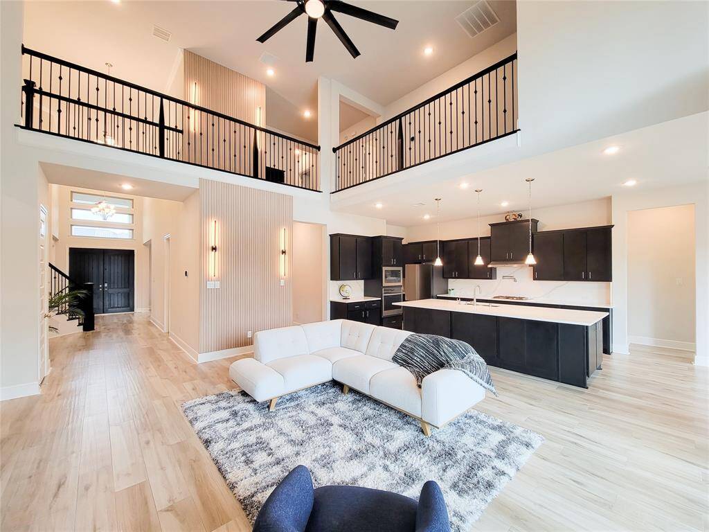 Beautiful wrought iron railings with contemporary lights on each of the floors brings in the pizzaz.