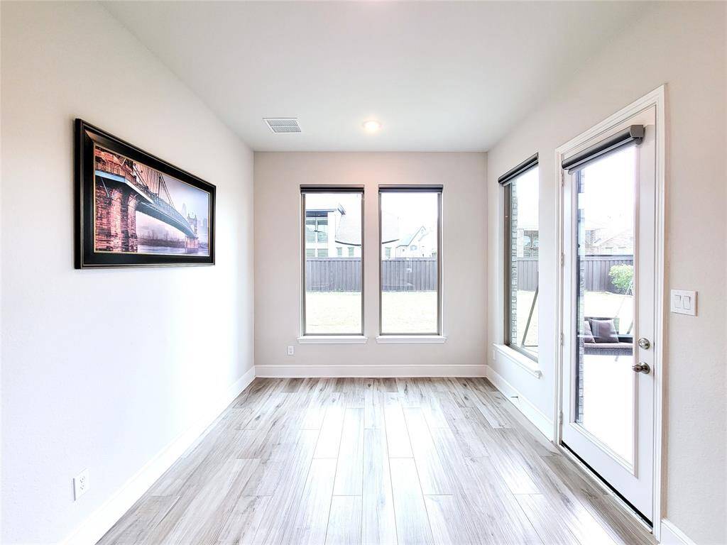 Breakfast area. Side door leads to covered Patio   & out-door Kitchen area.