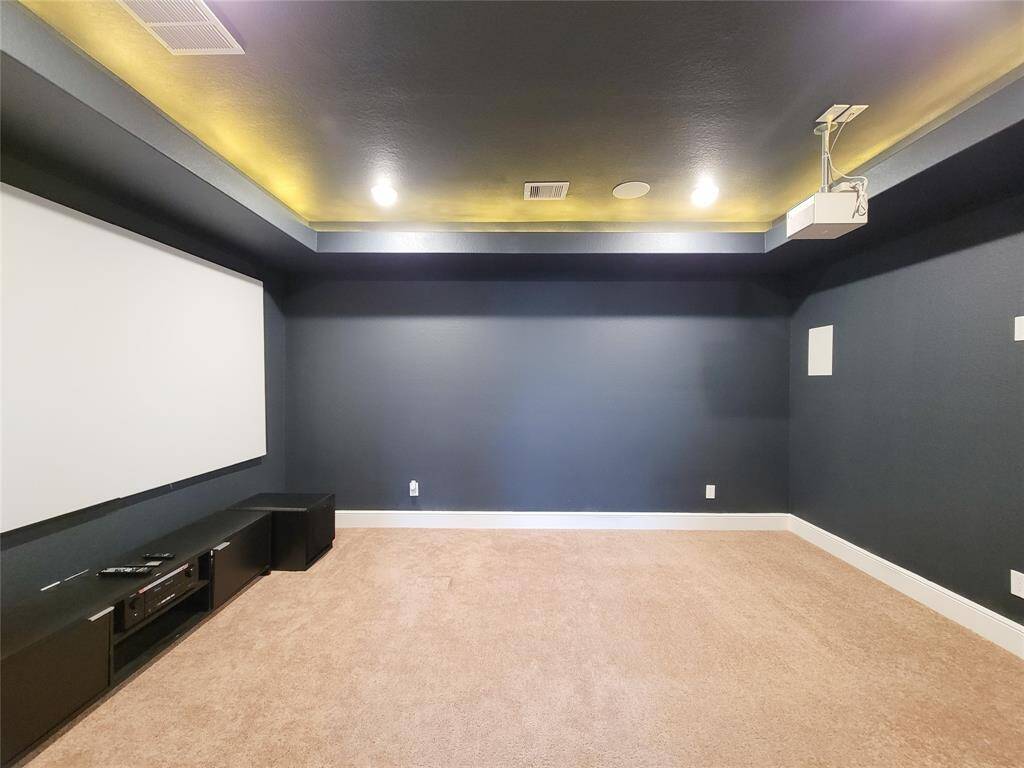 Media room with built in speakers for surround sound. NOTE: Screen, Projector & Woofer is excluded from lease.