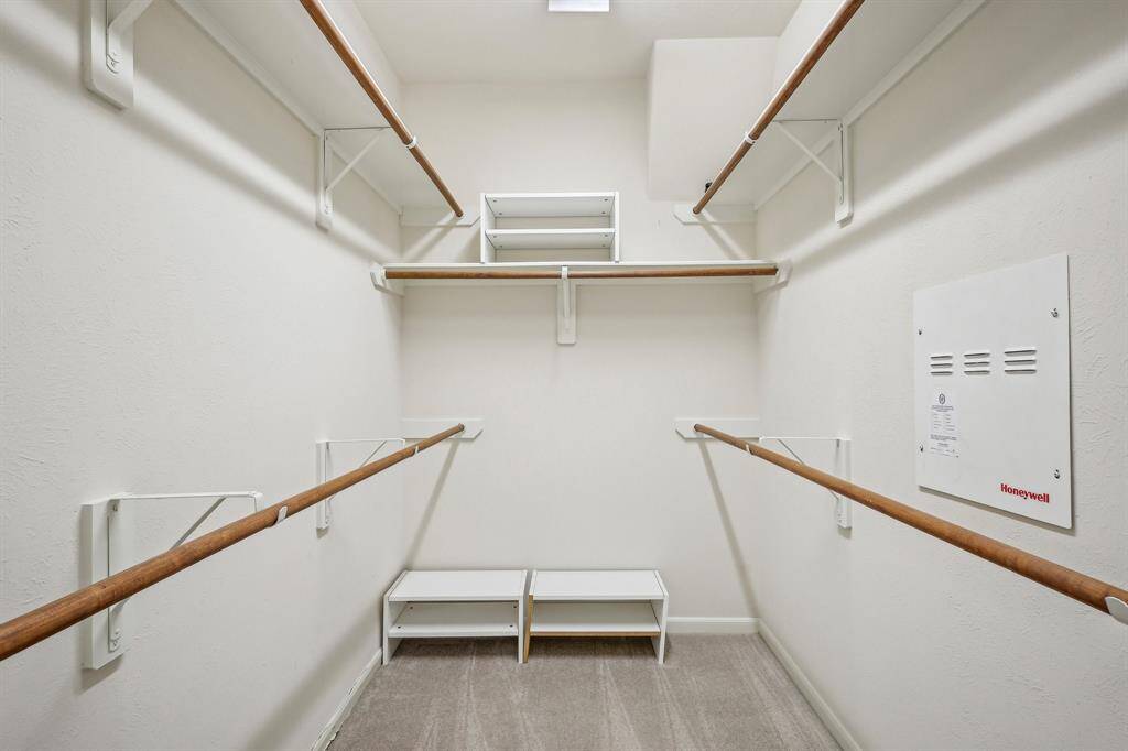 Primary walk-in closet.