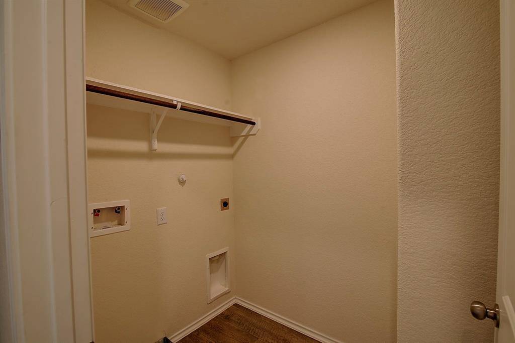 utility room with electric W/D connections.