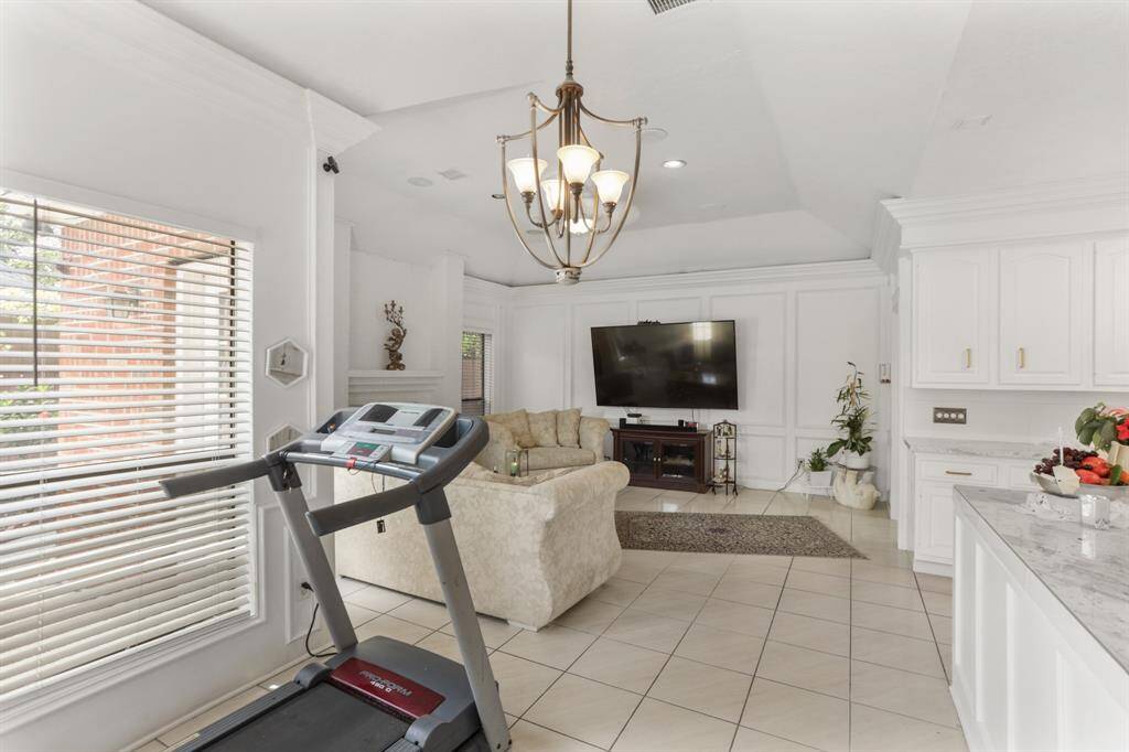 Located off the Kitchen is the breakfast room that is open to the family room