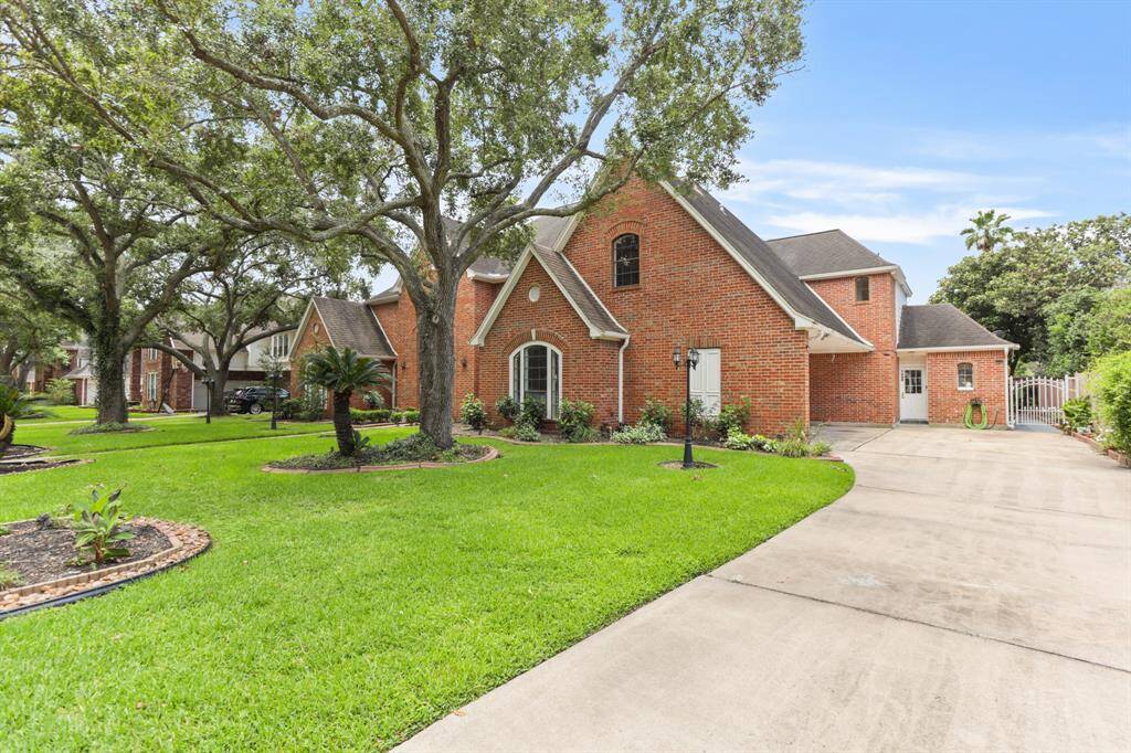 All Brick home with a 3 car attached garage, unusual high roof pitch, matures trees and landscaping that invites you and your guest to a very pleasurable experience.