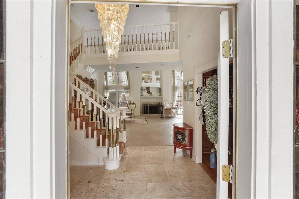 Upon entering this Grand home through a lead glass, wood door, you immediately see the beauty of this well maintained home. Custom Chandelier from Europe tells you are are going to be amazed at the elegance of this home.