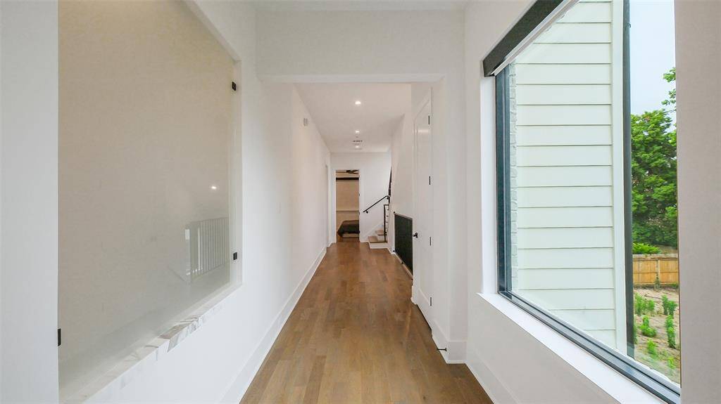 View from primary bedroom door into hallway.