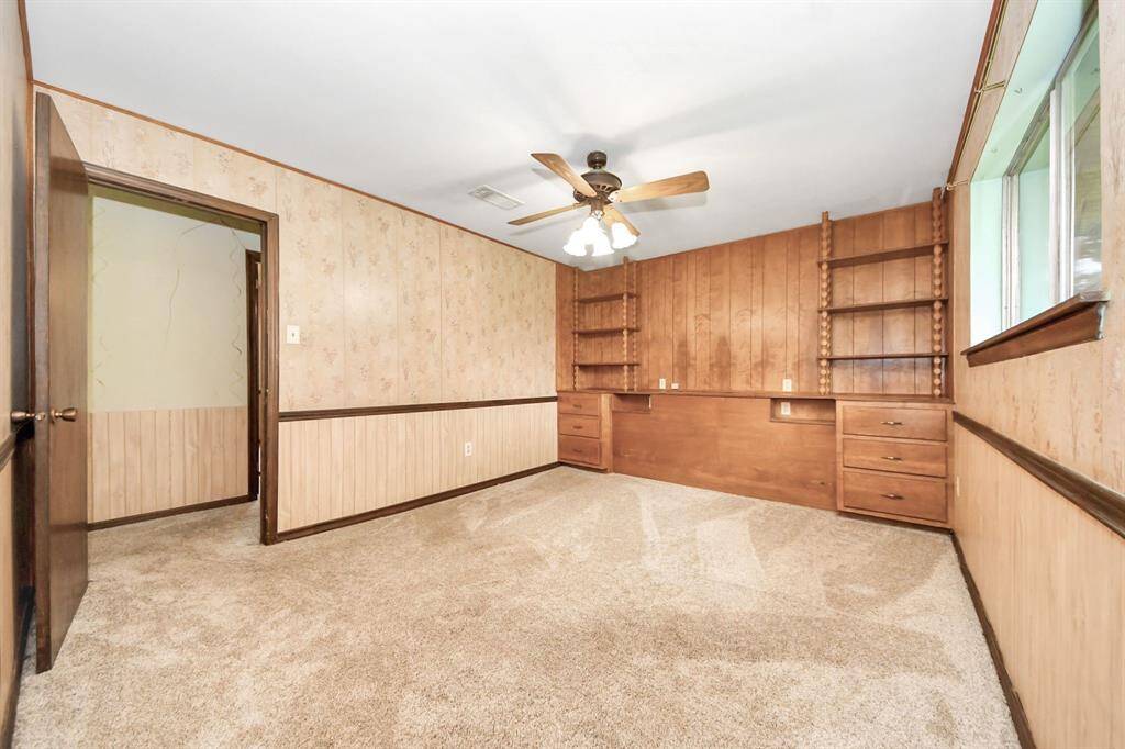 Primary room- tons of storage and built in bookshelves