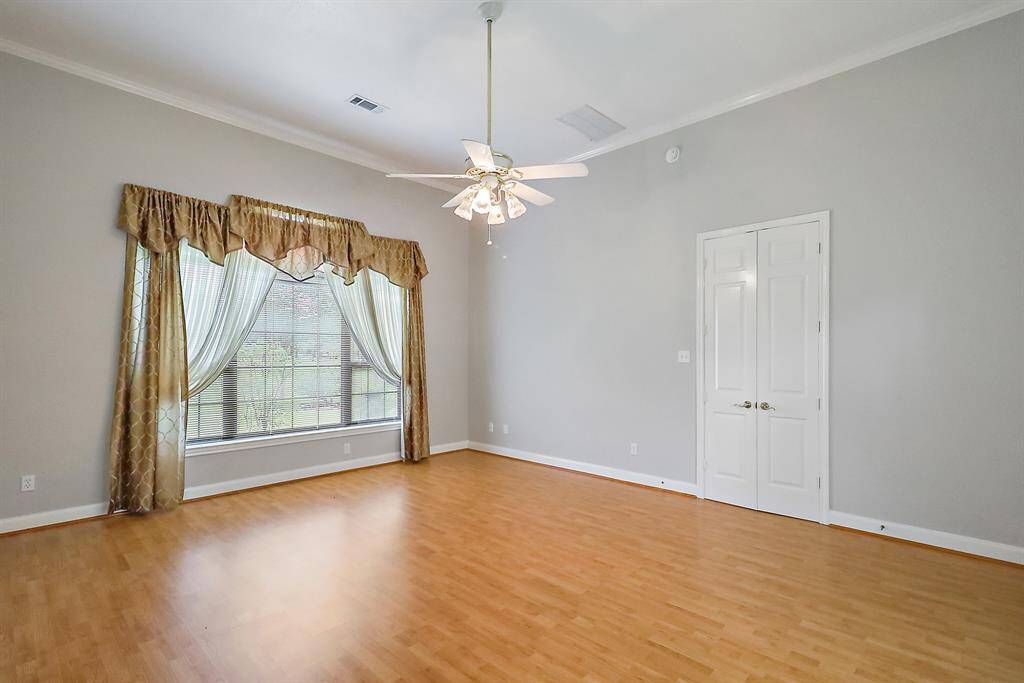 Another view of the primary bedroom
