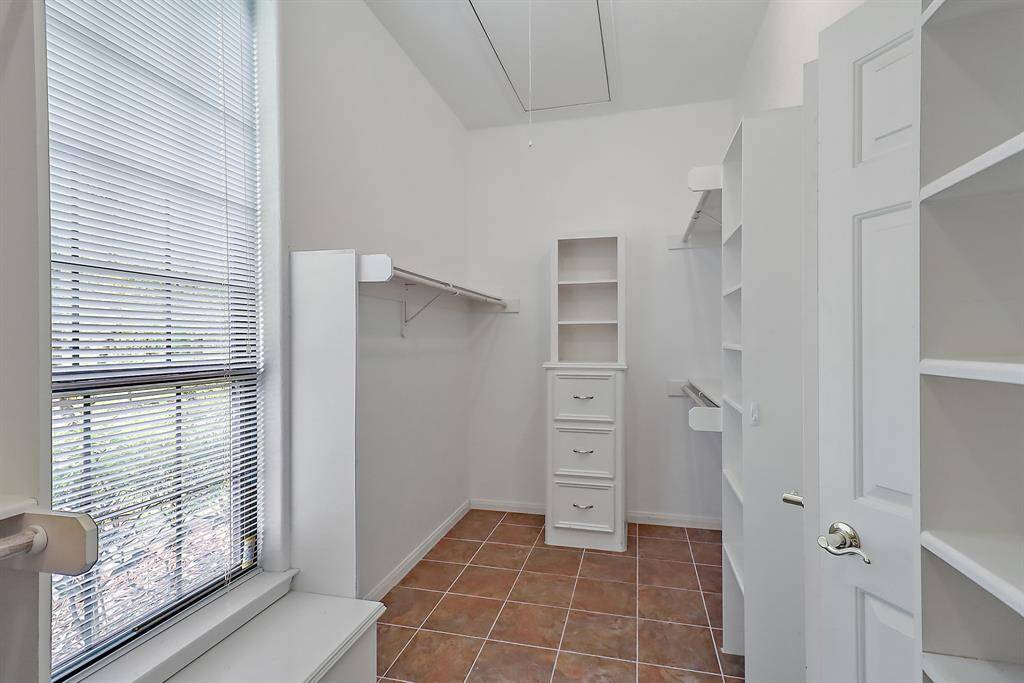 Walk in closet in primary bedroom