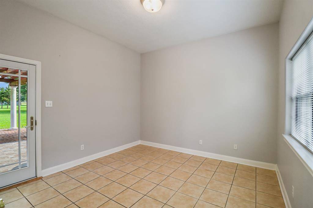 Bedroom downstairs with access to the backyard