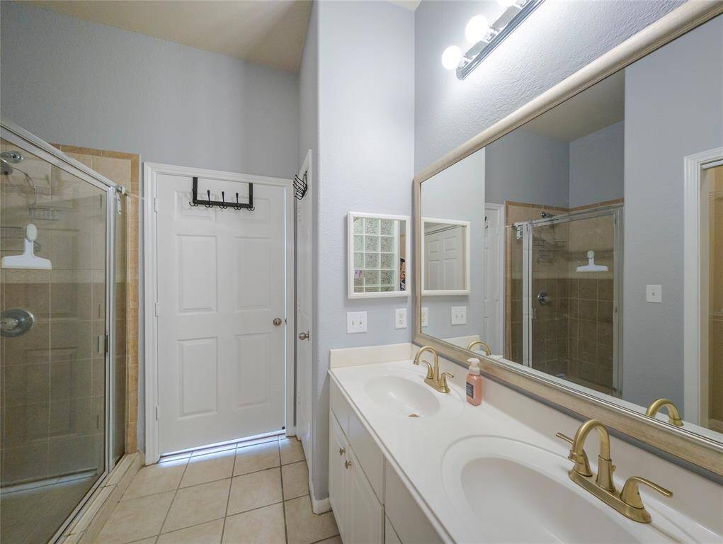 Primary bathroom with a tub and a separate shower