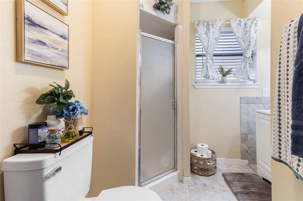 Retreat to your spacious primary suite (16x13) featuring abundant natural light & plenty of room for larger furniture items — your peaceful haven tucked privately within this smart split-bedroom layout.