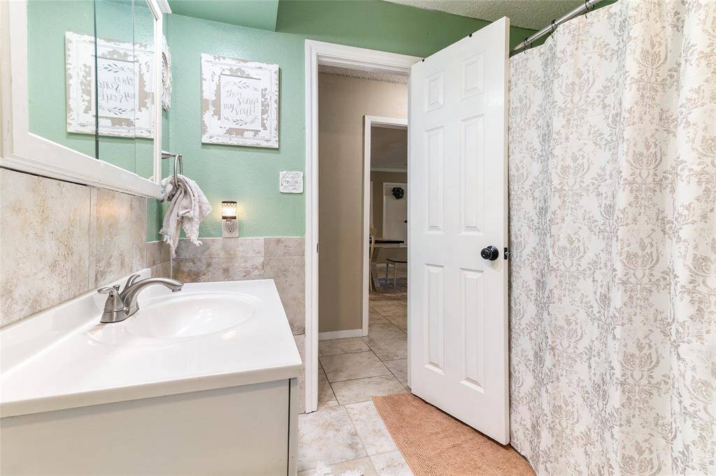 This bright and cheerful secondary bedroom includes a generously sized closet, providing plenty of storage space to keep everything organized and out of sight.