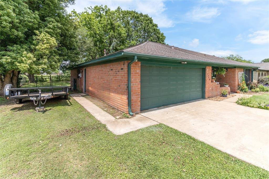 This well-maintained brick home with charming curb appeal features a covered front porch & mature landscaping — all nestled on a quiet street in the heart of Sweeny.