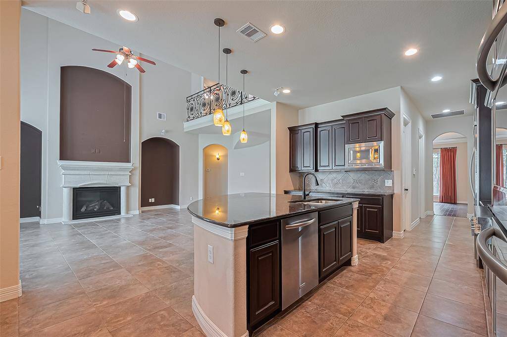 The magnificent living room flows nicely into the gourmet kitchen.