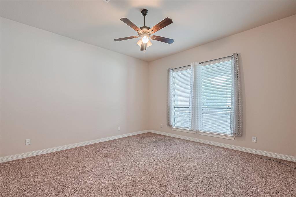 At 14x16, the charming downstairs bedroom has Frieze carpet, walk-in closet with convenient built-ins for easier access and 10 foot windows with 2" faux blinds.