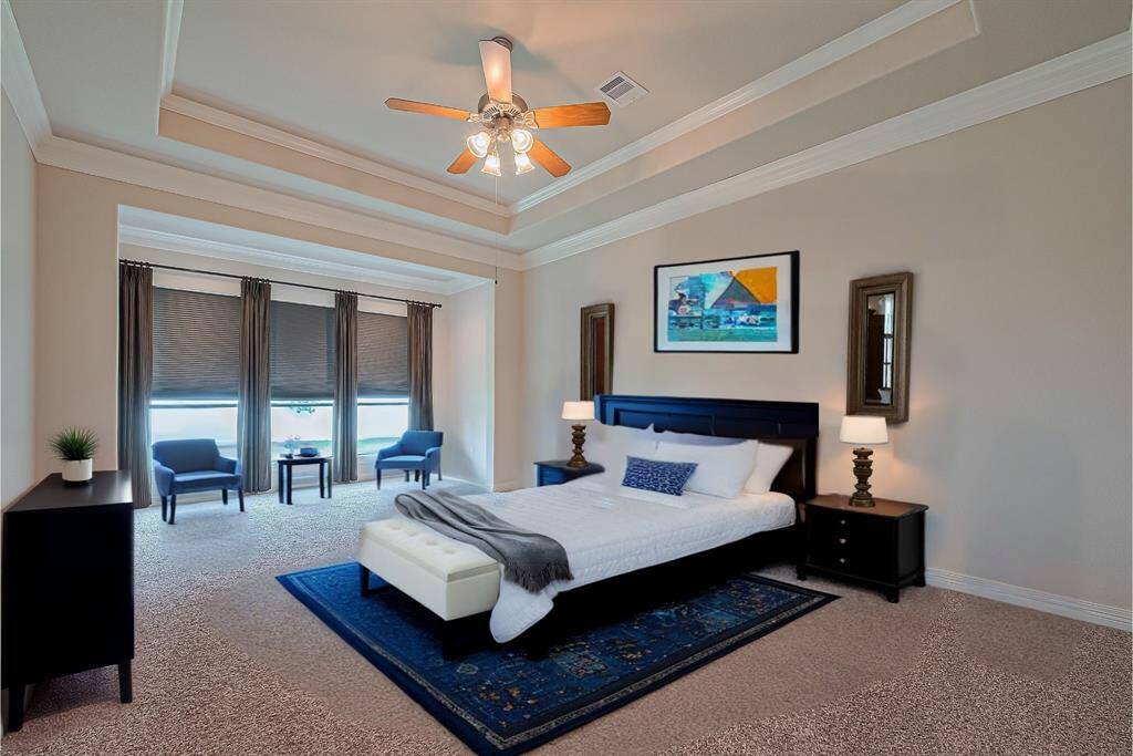 Primary bedroom with staged furniture.