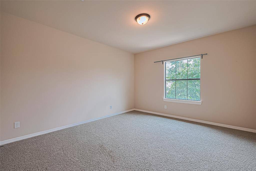 The first upstairs bedroom, at 14x13, includes a raised ceiling and a modern ceiling fan with light kit.